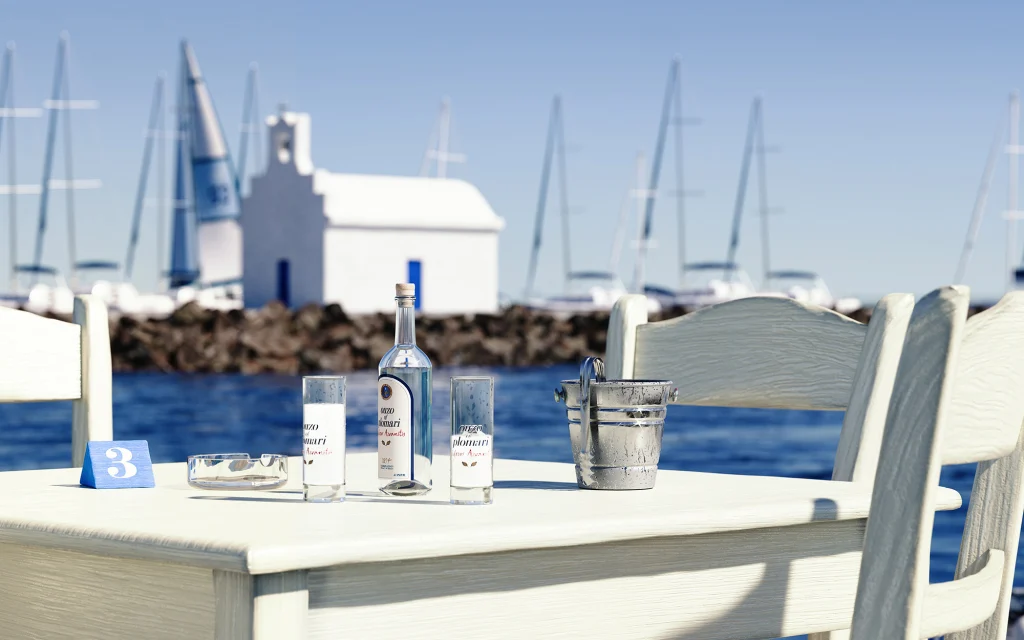 Stin Ygeia Mas detail of drinks and glasses in white wooden table next to the sea in a greek island